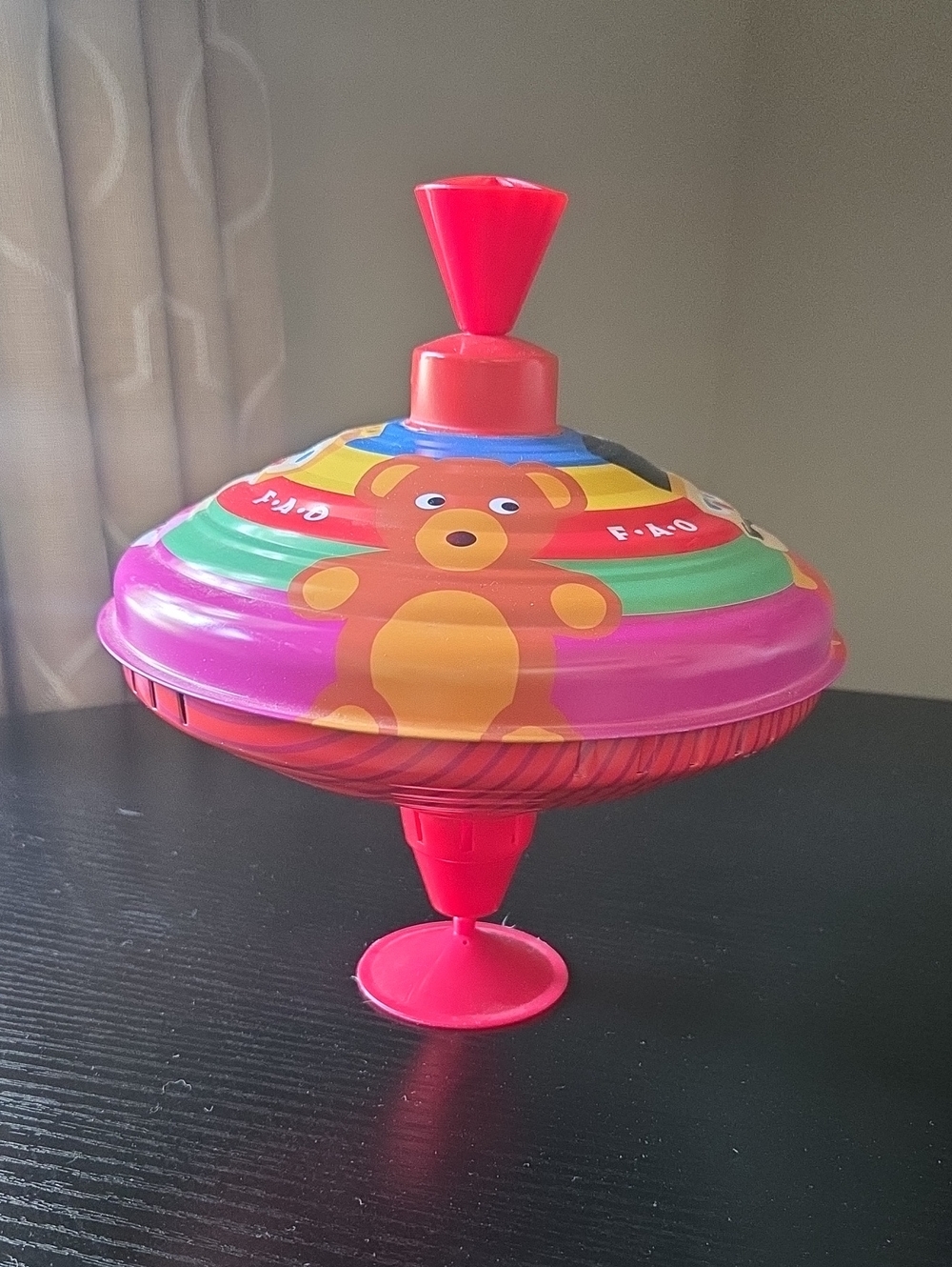 FAO Schwarz Bright Pink Spinning Top with Bear Graphic